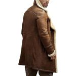 "A rugged yet stylish B3 Bomber Shearling Aviator Coat for Men, crafted from genuine sheepskin leather with a plush shearling lining. Features a high shearling collar, front buckle straps, rib-knit cuffs, and multiple pockets, combining vintage aviator design with modern functionality. Perfect for winter warmth and timeless fashion."